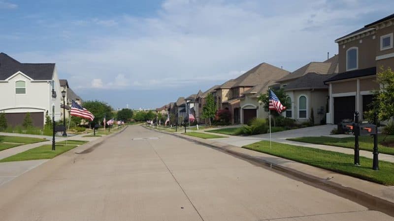 Fly your flag! 🙂 Every house on this street has a flag. Happy Fourth of ...